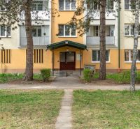 The entrance to the apartment building on Štúrová Street in Poprad, surrounded by greenery.