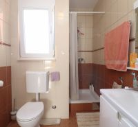 Bathroom with a shower in a family house.