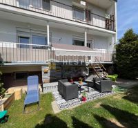 A garden at a 3-room apartment in Brezová pod Bradlom with outdoor seating and greenery.