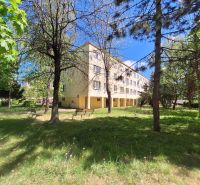 An apartment building surrounded by greenery on Železiarenská Street in Košice - the Šaca district.