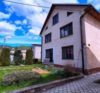 A family house on Jarabina Street in Jarabina surrounded by a garden and a paved walkway.