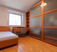 A room with a bed, a desk, and a built-in wardrobe in a 4-room apartment.