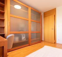Children's room in a 4-room apartment with storage space and a wooden decor floor.