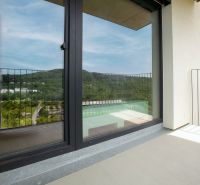 A balcony in a 1-room apartment on Polianky, Bratislava - Dúbravka with a view of greenery and hills.