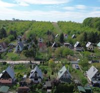 Cottages in Suchá nad Parnou in Nové Vinohrady, surrounded by greenery and spacious gardens.