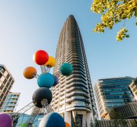 A high-rise building with a colorful sculpture on Pribinova Street in Bratislava - Old Town.