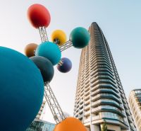 Colorful sculpture and skyscraper during the construction of apartments on Pribinova in Bratislava - Ružinov.