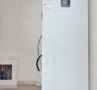 Boiler and expansion tank in the utility room of a family house.
