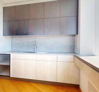A kitchen in a 4-room apartment with a wooden decor floor and a panoramic view.