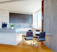 A kitchen in a 4-room apartment with an island, a wooden decor floor, and a dining table.