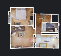 Floor plan of a 2-room apartment with wood-patterned flooring, living room, and kitchen.