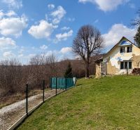 A family house on a residential plot in Lubina, Lubina Street, with a grassy garden.