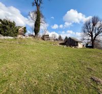 Lands - housing in the village of Lubina on Lubina Street, with trees and grassy area.