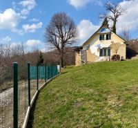 Plots - housing in Lubina on Lubina Street with a dilapidated building and lawn.