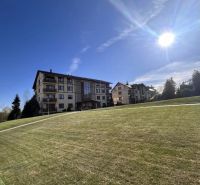 Buildings and grassy area in Stará Lesná, on Stará Lesná street, near a 3-room apartment.