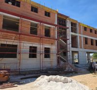 An unfinished 3-room apartment in the town of Srima with scaffolding and construction materials.