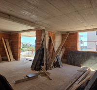 Interior design of a 3-room apartment in Srima with a sea view and brick walls.