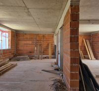 The construction of a 3-room apartment in Srima shows unplastered brick walls and building materials.