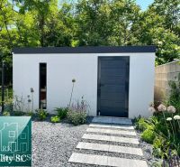 A family house in Senec with a modern garden and a stylish extension, surrounded by greenery.