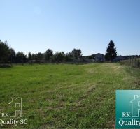 Plots - residential on Vrbová Street in Jelka, surrounded by trees and grass.
