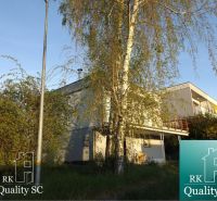 A cottage in Senec at SUNNY LAKES SOUTH with a garden and greenery.