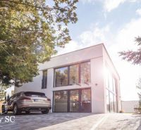 Family house at Sunny Lakes South in Senec with adjacent parking and greenery.