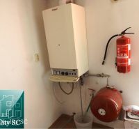 Combination of a gas boiler and a fire extinguisher in a family house.