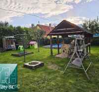 A family house in the town of Tureň with a garden gazebo, swing, and children's playground.