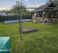 The garden of a family house in Tureň, Tureň with a gazebo, swimming pool, and lawn.