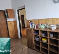 A kitchen with a wooden floor decor in a family house.