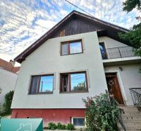 A family house in the town of Tureň on Tureň Street with a front garden and a staircase.