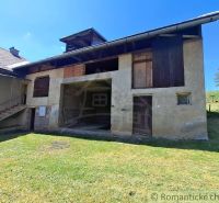 A family house in Heľpa with a typical facade and a shelter in the yard.