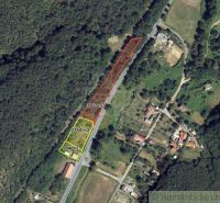 An aerial view of residential plots in Šiatorská Bukovinka, surrounded by forest and nature.