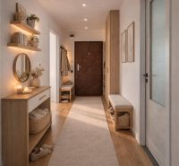 Entrance hall with a mirror, shelves, and a floor with a wooden decor in a 4-room apartment.