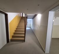 Hallway in the building with stairs and entrances on SNP Quarter, Trenčianske Teplice.