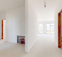 The interior of a family house with white walls and empty passages, ready for completion.