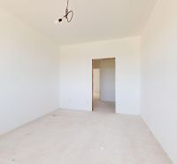 Interior of a family house with an empty room and concrete floor.