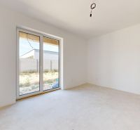Interior of a family house with double doors and a view of the garden.