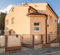 A family house on Mlynska Street in Piešťany with an orange facade and a fence.