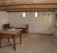 A room in a family house with wooden furniture and wooden floor decor.