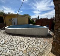 The pool by the cottage on Agátová Street in Šahy with stone paving.