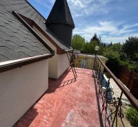 The terrace of the cottage on Agátová Street in Šahy with a view and decorative railing.