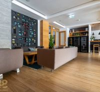 Living room in a holiday apartment with a decorative wall and a wooden decor floor.