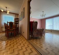 Interior of a family house with wooden floor decor and a separate dining room and living room.