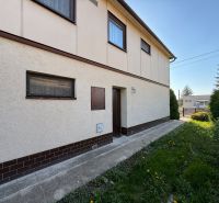A family house in Zlaté Moravce with a lawn and a driveway.