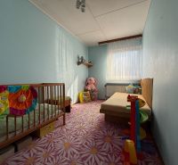Children's room with pastel walls and carpet, interior of a family house.