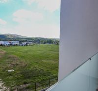 View from a 4-room apartment on Moravanská Street in Banka, green fields and landscape.