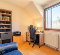 A workspace with a wooden floor decor in a 4-room apartment.
