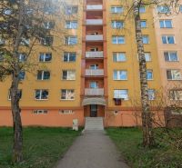 Apartment building on Partizánska Street in Poprad with a staircase and greenery in the surroundings.
