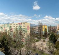 A view from a 4-room apartment on Partizánska Street in Poprad of the surrounding greenery and apartment buildings.
